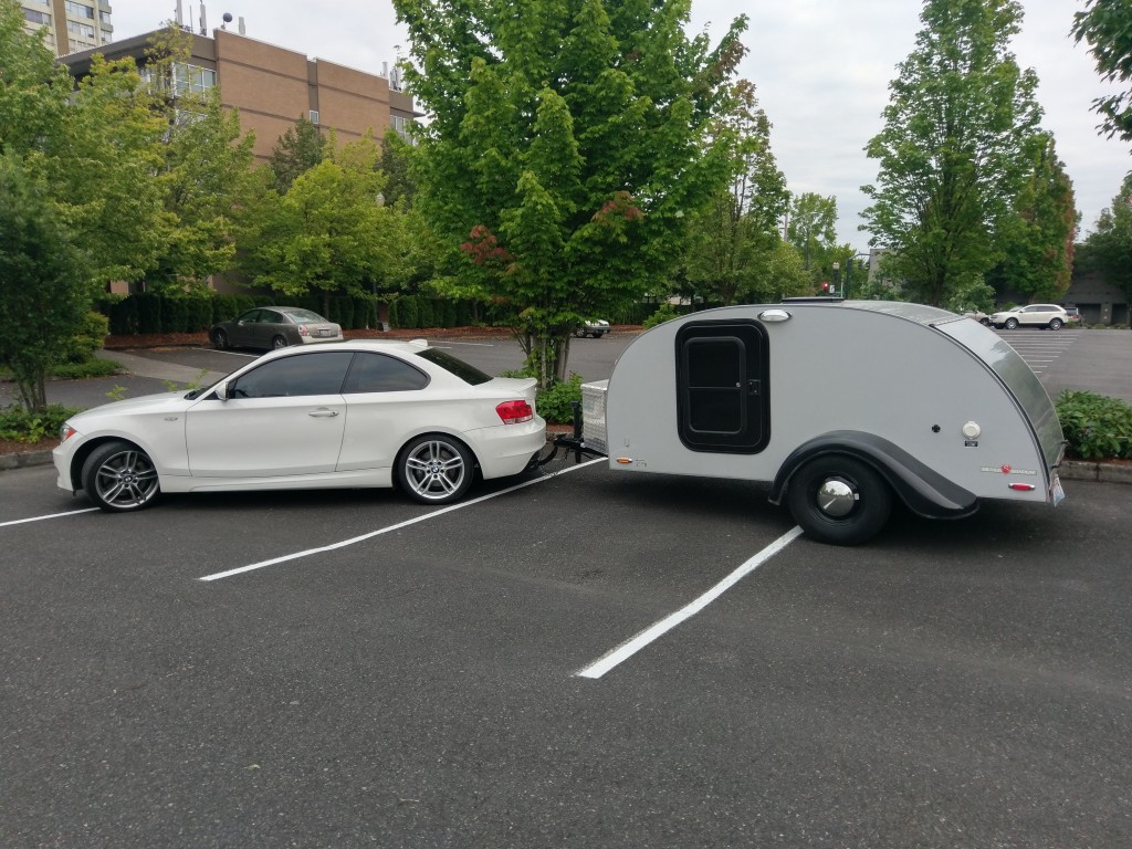 BMW 135i towing a teardrop camper trailer